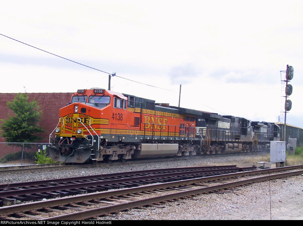 BNSF 4138 leads a NS train thru Southern Junction